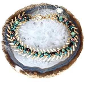 Goldtone and rhinestone wrap bracelet